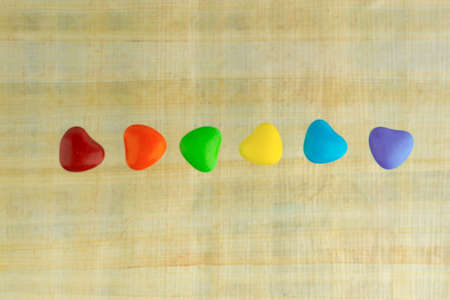 LGBT sweet flag: rainbow colored caramels lie in a rowの写真素材