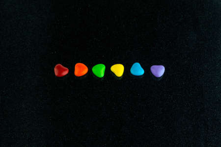 LGBT sweet flag: rainbow colored caramels lie in a rowの写真素材