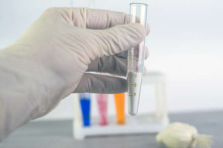 detection of cocaine and heroin: a laboratory medical officer holds in his hand an instrument with a...