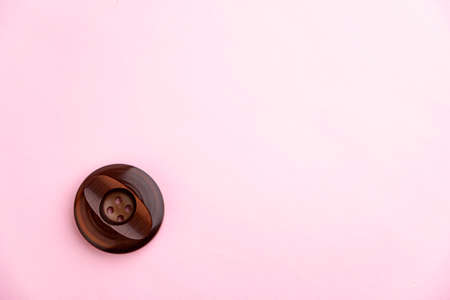 beautiful old retro button on pink background, short focusの写真素材