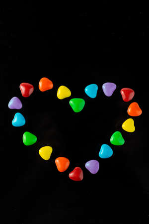 LGBT sweet flag: rainbow colored heart shaped caramels