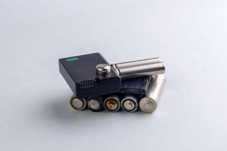 mercury and cadmium pollution of the planet: a few spent batteries are isolated on white, short...