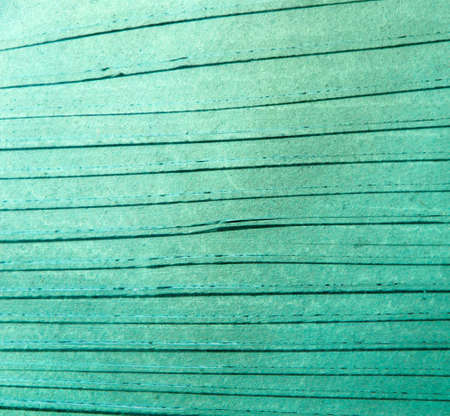 grunge background: long parallel cracks on emerald glassの写真素材