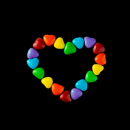 LGBT sweet flag: rainbow colored heart shaped caramelsの写真素材