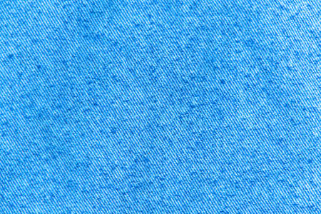 classic grunge background: real old american denim, close, scar and thread, short focus, top viewの写真素材