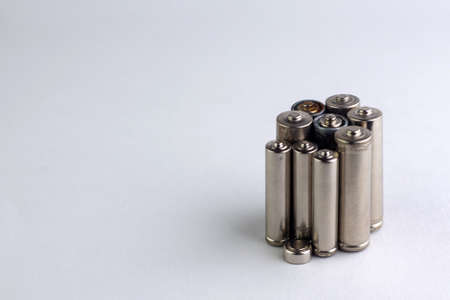 recycling of mercury and cadmium: several batteries are isolated on white, short focus, toningの写真素材