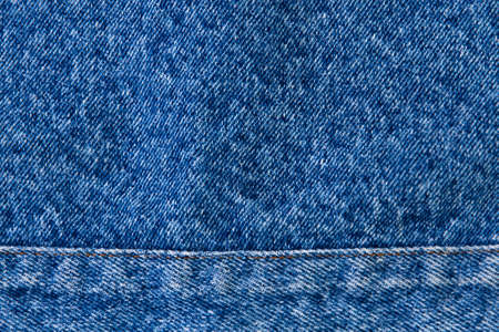 classic grunge background: real old american denim, close, scar and thread, short focus, top viewの写真素材