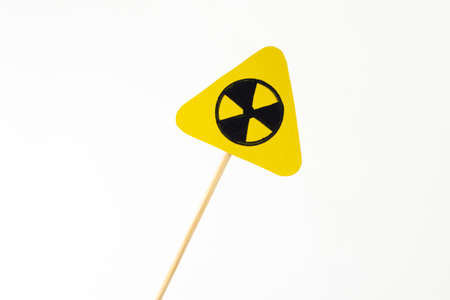 triangular radiation hazard sign on whiteの写真素材