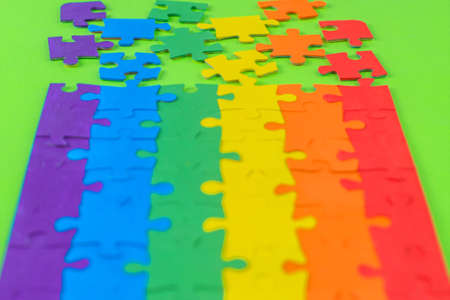 sexual minority pride concept: LGBT flag partially parsed on green background, short focusの写真素材