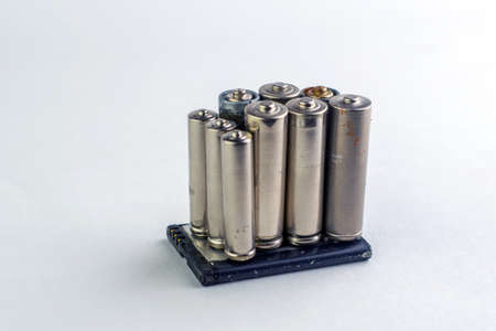 recycling of mercury and cadmium: several batteries are isolated on white, short focus, toningの写真素材