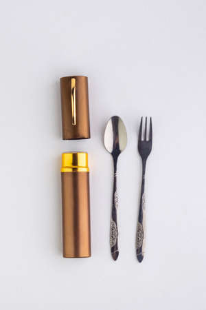 a set of dining items for camping: small spoon and fork, storage caseの写真素材