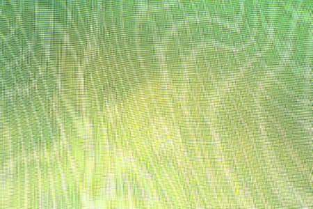 abstract background: unique wavy overlay pattern of two grids, blur and tint in light pear color