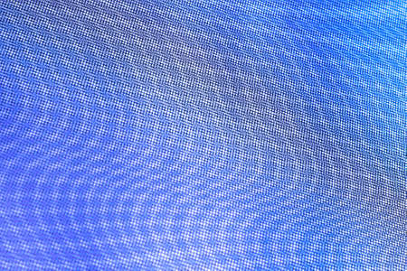 abstract background: unique wavy pattern of overlaying two grids, blurry and tinted to classic blue, purple, crimson shadesの写真素材