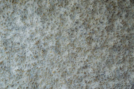 decorative coating with fine stone abrasive, dark background