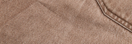 fabric grunge background, real cotton denim, brown, wrinkles, frayed, seam on the canvas, closeの写真素材