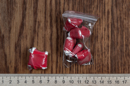 evidence of smuggling traffic: packaging of an unknown drug next to the forensic scale