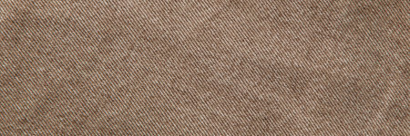 fabric grunge background, real cotton denim brown, wrinkled, frayed, closeの写真素材