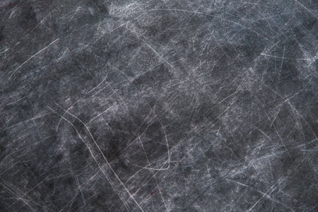 back to school: black chalkboard with blurry traces of white chalk and crayons, minor scratchesの写真素材