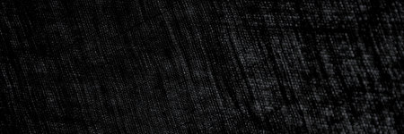 abstract rough dark background of linen natural fabric on the light, short focus