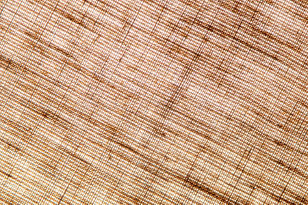 abstract rough colored linen natural fabric background, toning, short focus