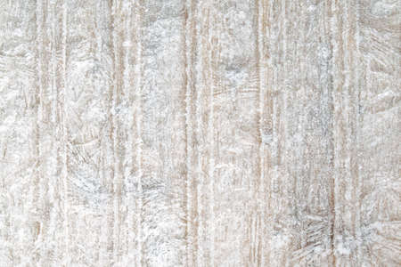 winter frosty background: boards covered with snowflakes and hoarfrost, ice patterns, wood texture,...