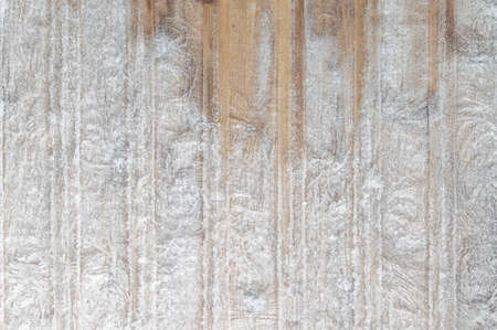 winter frosty background: boards covered with snowflakes and hoarfrost, ice patterns, wood texture, close, toningの写真素材