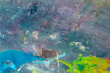 creative colored background: a temporary pattern of strokes and stains of fresh colored primer on linen linen when primingの写真素材