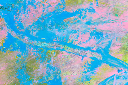colorful creative motley background: smudged residues of oil paints on a wooden palette, short...