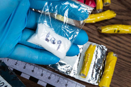 evidence of smuggling traffic: Packaging of a narcotic substance in the hand of a forensic expert...