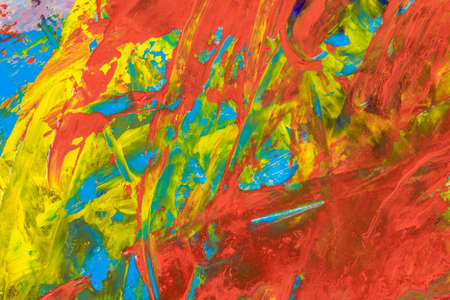 colorful creative motley background: smudged residues of oil paints on a wooden palette, short focus, selective blurの写真素材