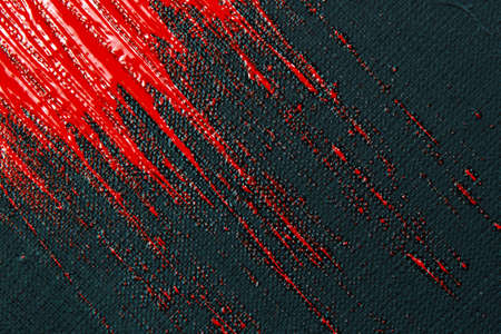 abstract creative background: red spots, strokes and splashes of colored primer when toning a black...
