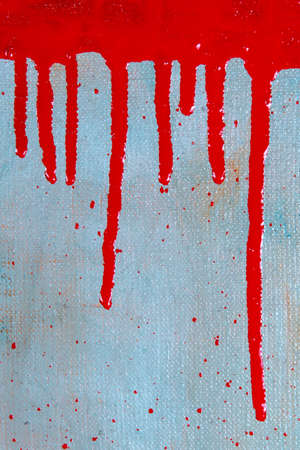 abstract creative background: a red spot with smudges of colored primer when toning the canvas, a...