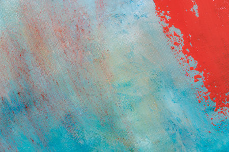 abstract creative background: red blurred stains of colored primer when toning the canvas, temporary object.の写真素材