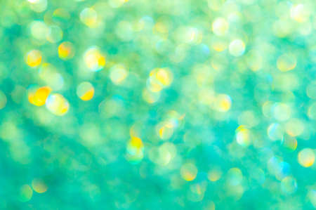 bright glitter background: bokeh effect from many colored lights on frozen glass, toningの写真素材
