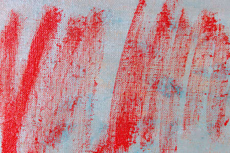 abstract creative background: red blurred stains of colored primer when toning the canvas, temporary...