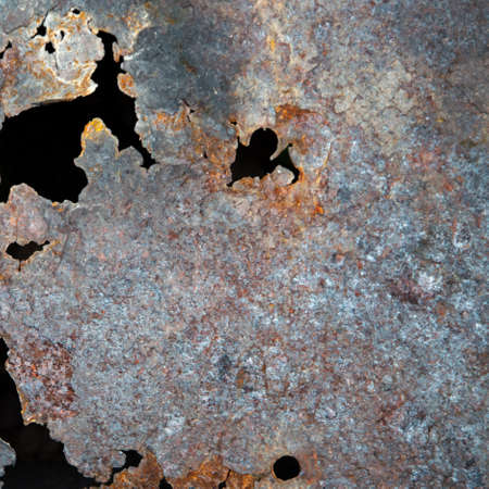grunge background: rust on an old painted metal surface, holes from through corrosion of steel,...