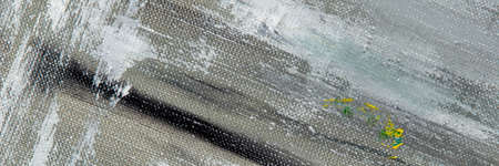 creative colored background: a temporary pattern of strokes and stains of fresh colored primer on...