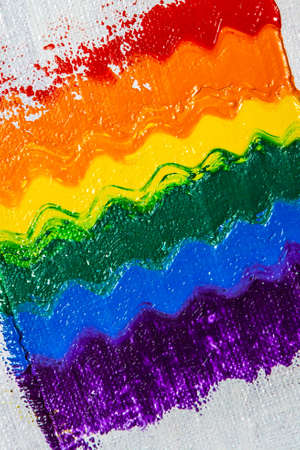 several strokes of multi-colored paint depict a frag of the LGBT community on a light surface. short focus, blur. A temporary object, not a piece of art.の写真素材