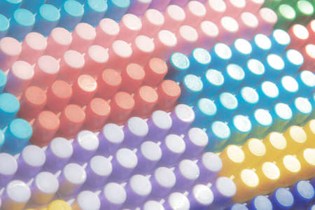 children's play background: the plane of plastic multi-colored bricks, blur, selective focusの写真素材