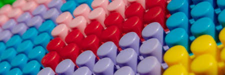 children's play background: the plane of plastic multi-colored bricks, blur, selective focusの写真素材