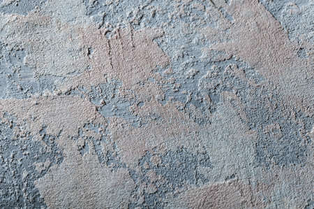 surface covered with decorative plaster with a chaotic pattern, multi-colored spotsの写真素材