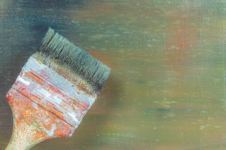 abstract colored creative background - rough linen canvas unevenly covered with multi-colored primers, reflections of light, wide brush. Toning, blur. Temporary object.の写真素材