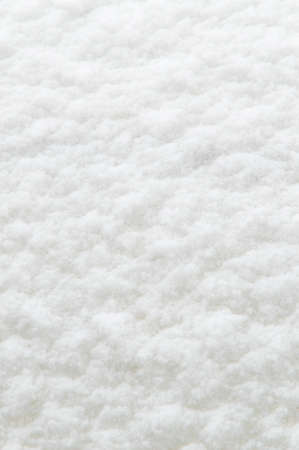 winter background: fresh clean even snow, large snowflakesの写真素材