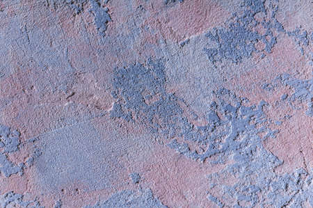 surface covered with decorative plaster with a chaotic pattern, multi-colored spotsの写真素材