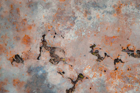 grunge background: rust on an old painted metal surface, holes from through corrosion of steel,...