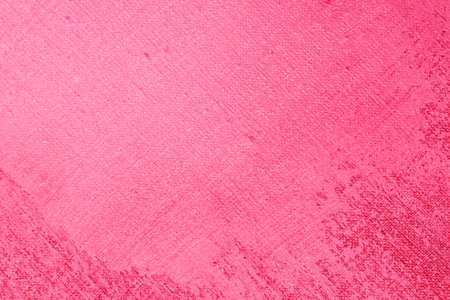 bright scarlet background: thick acrylic paint applied in a thin uneven layer on a flat surface, light and dark areasの写真素材