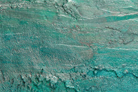 abstract background: textured plaster with emerald turquoise color, close