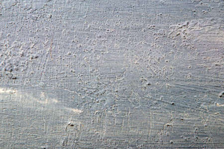 abstract background: light textured plaster, color toning, close