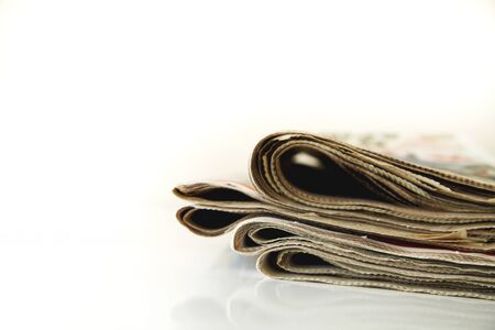 Reading newspaper on tableの写真素材