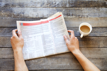 Man hands reading newspaperの写真素材